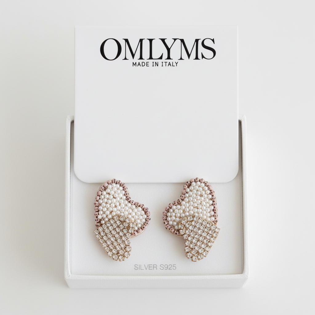 Handcrafted beaded heart earrings with pearl and crystal details in OMLYMS packaging